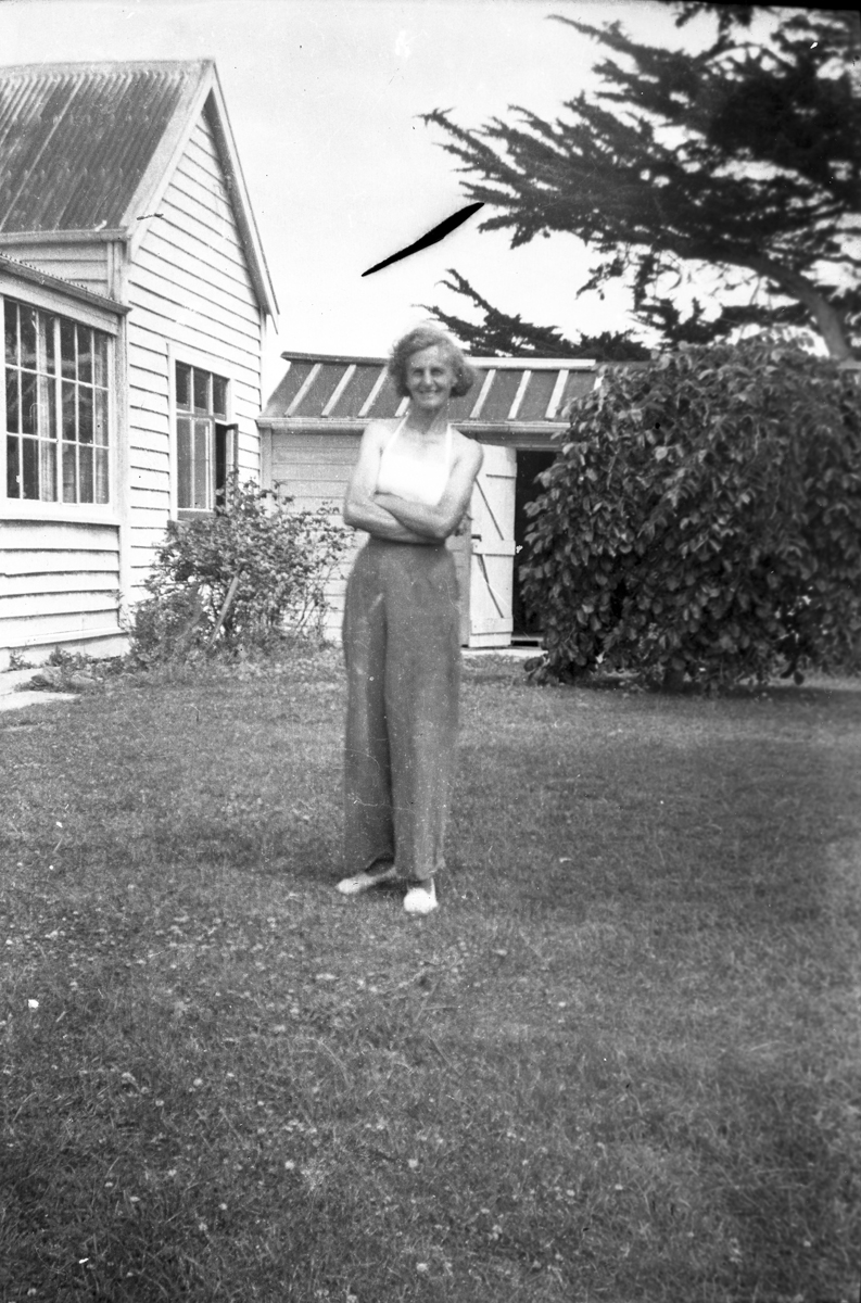 Mable Palmer (Sinclair) at the old farm house Taieri Beach