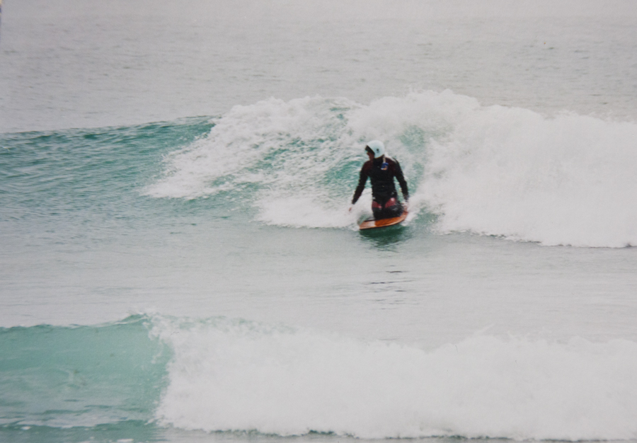 Lloyd kneeboarding on his wood board Murdering Bay